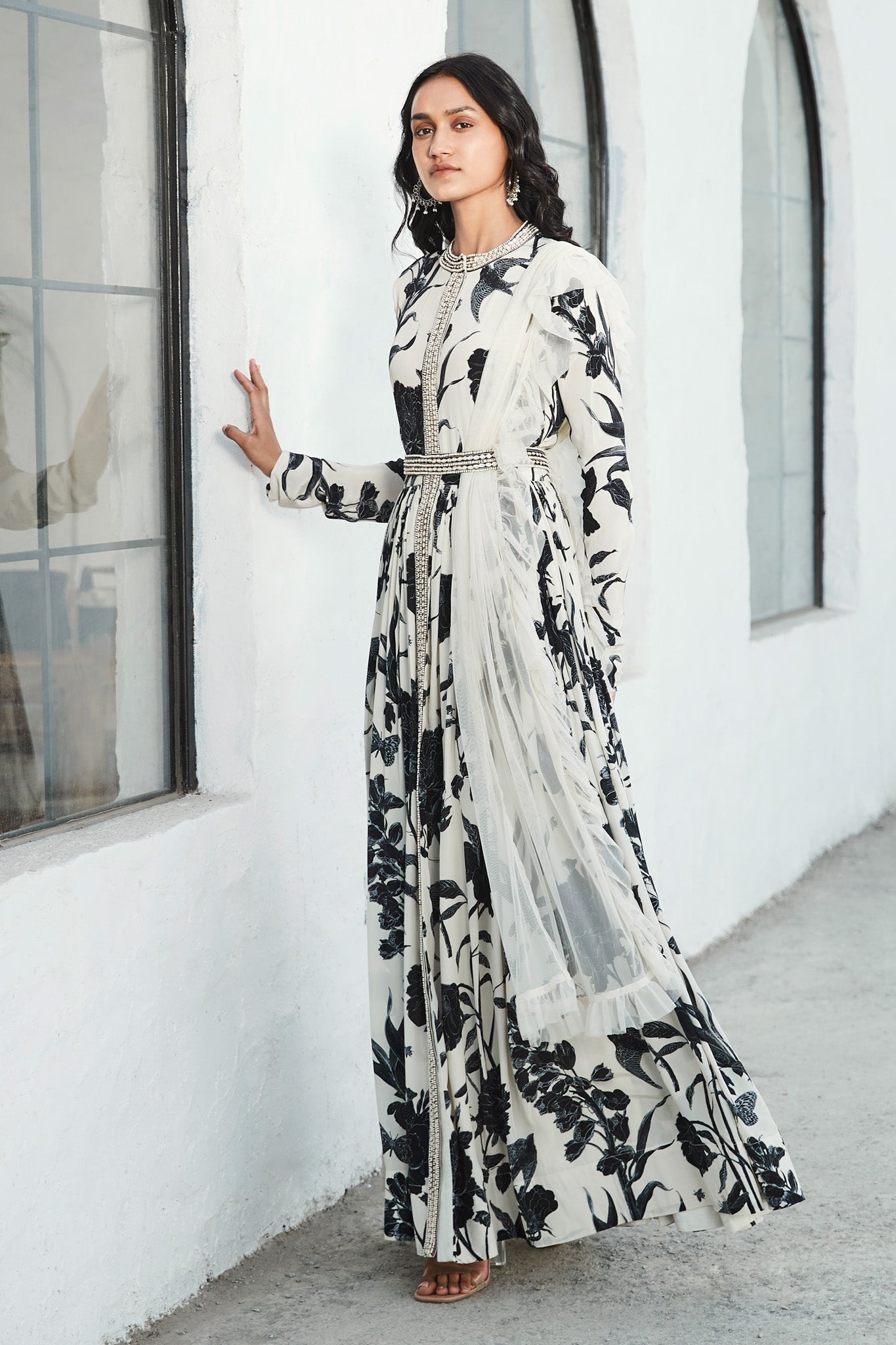 Buy a black & white floral printed full-sleeved, crepe floor-length kurta. Dazzle on weddings and special occasions with exquisite Indian designer dresses, sharara suits, Anarkali suits, and wedding lehengas from Pure Elegance Indian fashion store in the USA.