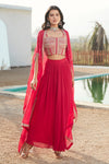 Buy rani pink skirt set adorned with a corset blouse & cape. Dazzle on weddings and special occasions with exquisite Indian designer dresses, sharara suits, Anarkali suits, and wedding lehengas from Pure Elegance Indian fashion store in the USA.