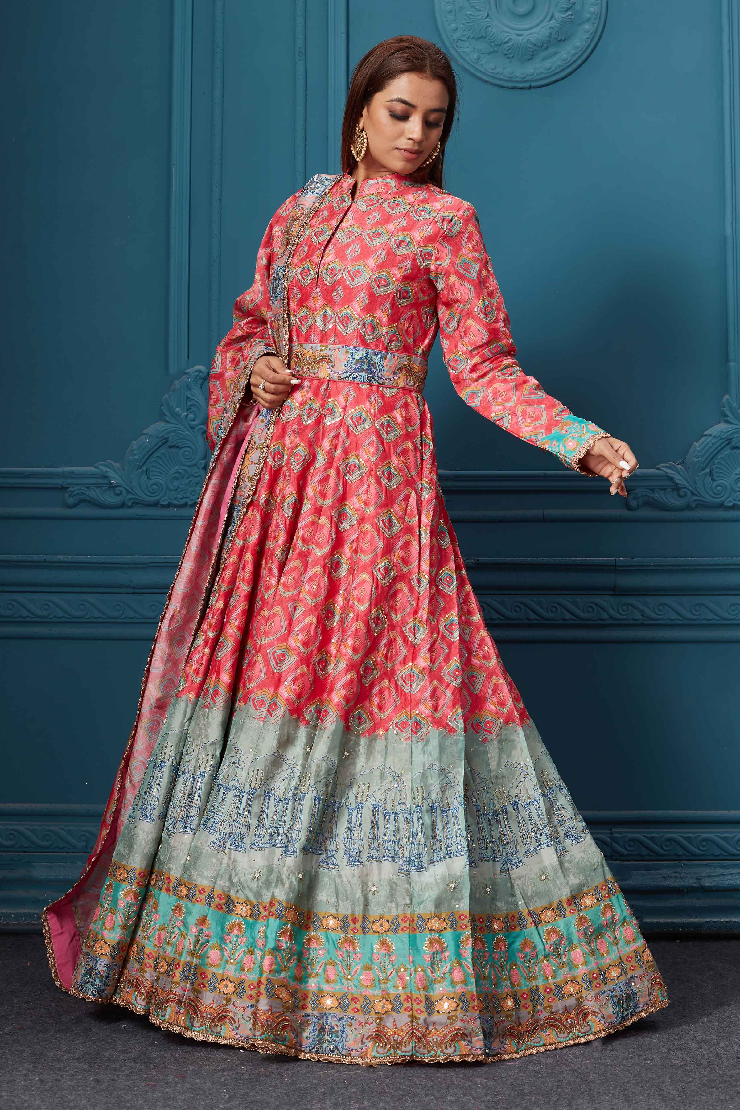 Shop a gorgeous red blue multicolored printed anarkali suit set with embroidery. Featuring a beautiful belt, collar neck, full-length sleeves, and a stylish dupatta. Shop online at Pure Elegance or visit our store in the USA.