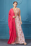 Buy a light pink embroidered sleeveless Anarkali kurta featuring embroidery, and red dupatta with tassels. Dazzle on special occasions with exquisite Indian designer dresses, sharara suits, Anarkali suits, bridal lehengas, and sharara suits from Pure Elegance Indian clothing store in the USA. Shop online from Pure Elegance.