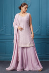 Shop lavender embroidered sleeveless short kurti suit with plazzo and Dupatta. Dazzle on special occasions with exquisite Indian designer dresses, sharara suits, Anarkali suits, bridal lehengas, and sharara suits from Pure Elegance Indian clothing store in the USA. Shop online from Pure Elegance.