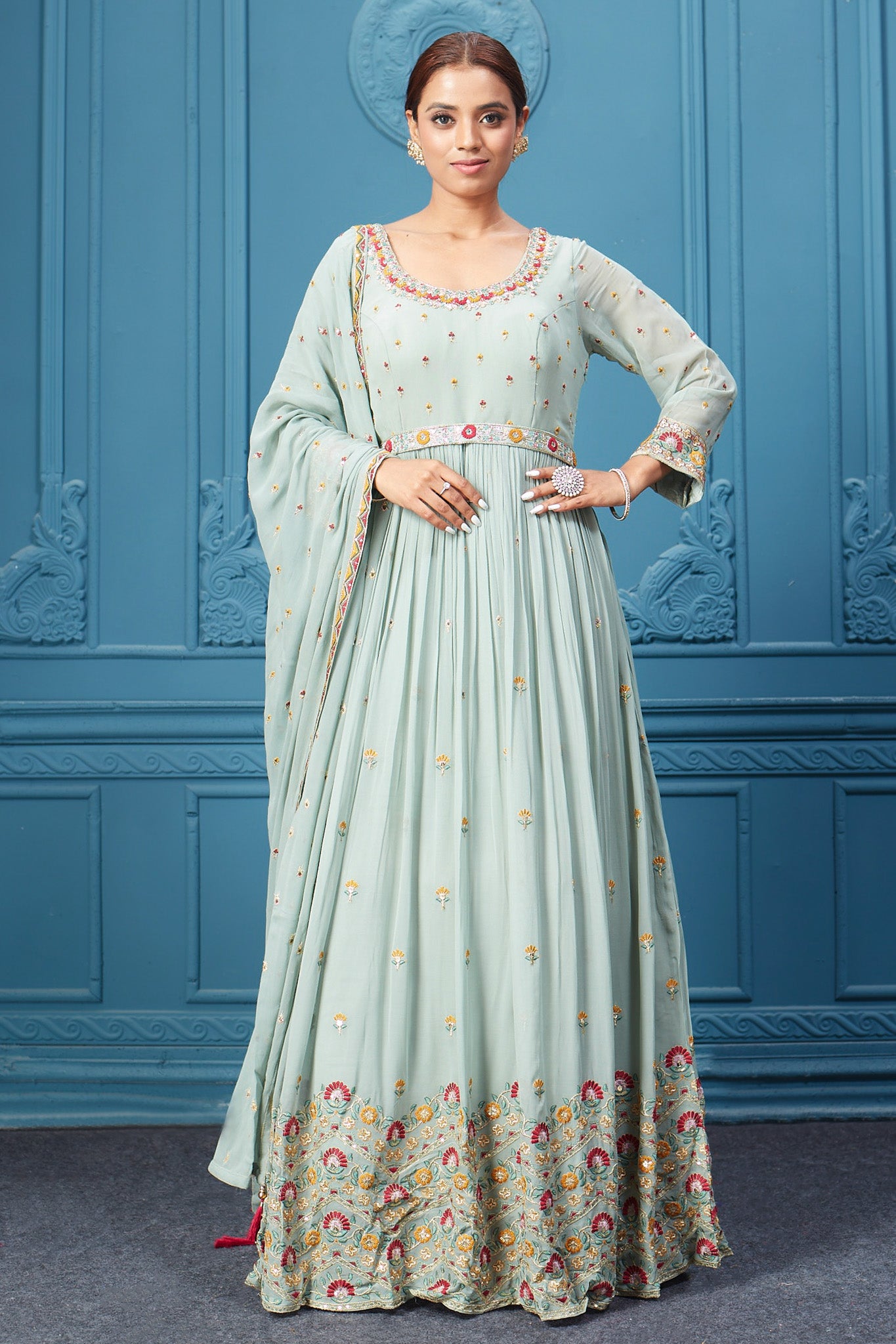 Shop a pastel green embroidered full sleeves anarkali suit with floral embroidery in the bottom, belt embroidered, and Dupatta. Dazzle on special occasions with exquisite Indian designer dresses, sharara suits, Anarkali suits, bridal lehengas, and sharara suits from Pure Elegance Indian clothing store in the USA. Shop online from Pure Elegance.