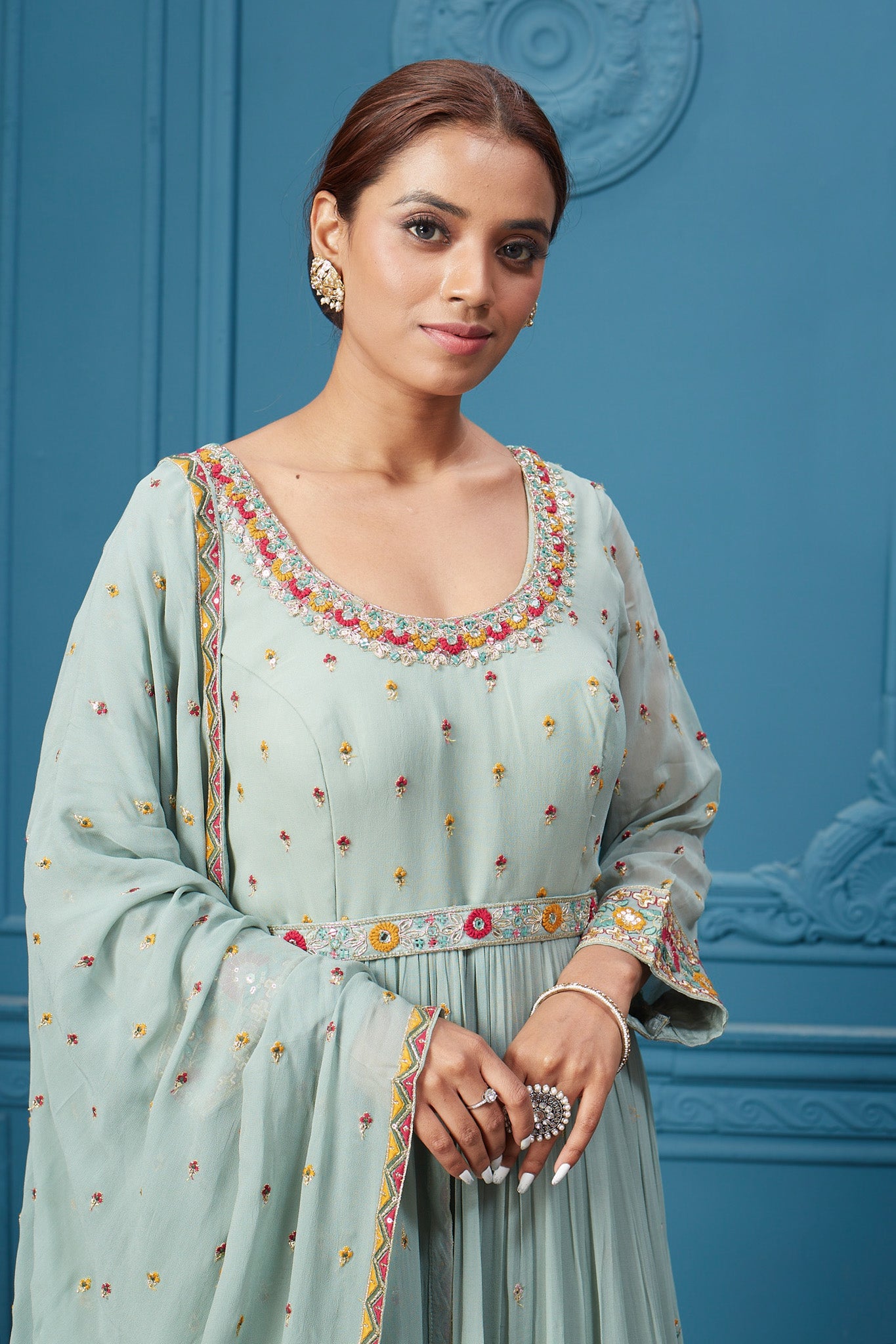 Shop a pastel green embroidered full sleeves anarkali suit with floral embroidery in the bottom, belt embroidered, and Dupatta. Dazzle on special occasions with exquisite Indian designer dresses, sharara suits, Anarkali suits, bridal lehengas, and sharara suits from Pure Elegance Indian clothing store in the USA. Shop online from Pure Elegance.