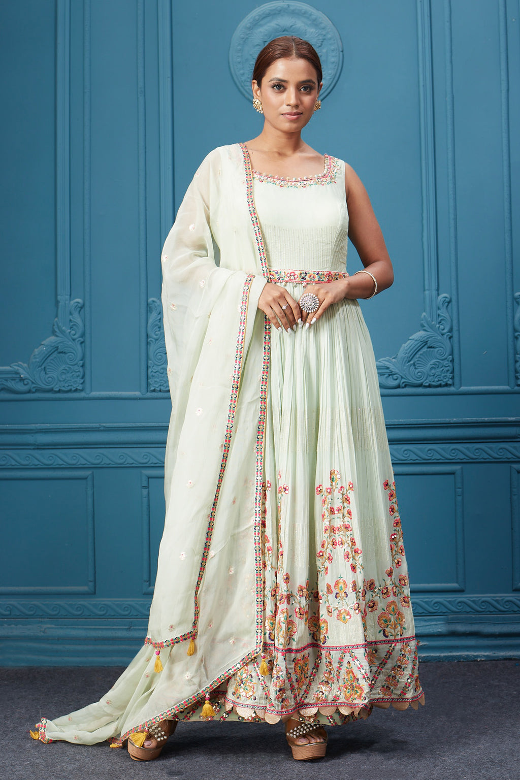 Shop a pastel green embroidered full sleeves anarkali suit with multicolored embroidery in the bottom, belt embroidered, and Dupatta. Dazzle on special occasions with exquisite Indian designer dresses, sharara suits, Anarkali suits, bridal lehengas, and sharara suits from Pure Elegance Indian clothing store in the USA. Shop online from Pure Elegance.