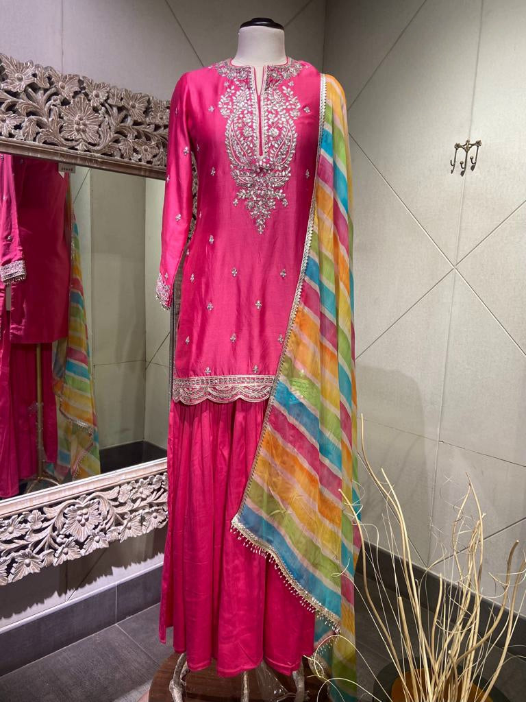 Shop stunning pink crepe silk sharara suit online in USA with multicolor dupatta. Look your best on festive occasions in latest designer saris, pure silk saris, Kanchipuram silk sarees, handwoven saris, tussar silk sarees, embroidered saris from Pure Elegance Indian clothing store in USA.-full view