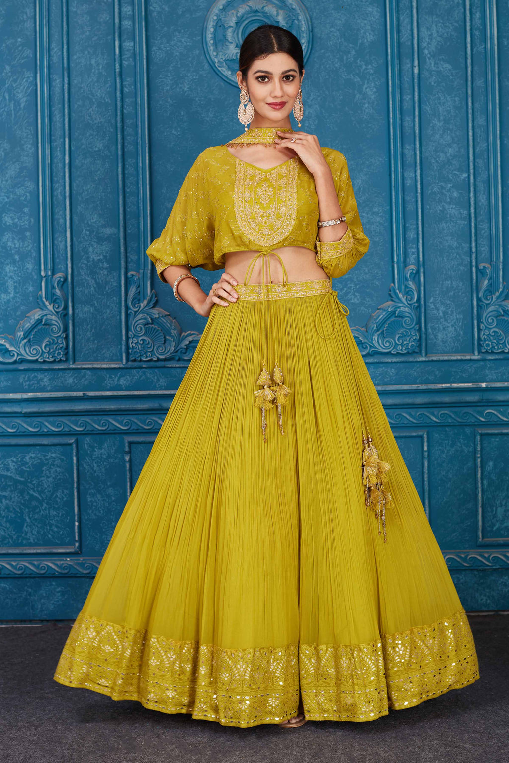 Buy olive green embroidered georgette lehenga online in USA with dupatta. Slay in style at wedding festivities in this beautiful designer lehengas. hand embroidered lehengas, Bollywood lehenga, Anarkali suits, sharara suits from Pure Elegance Indian saree store in USA. -full view