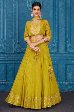 Buy olive green embroidered georgette lehenga online in USA with dupatta. Slay in style at wedding festivities in this beautiful designer lehengas. hand embroidered lehengas, Bollywood lehenga, Anarkali suits, sharara suits from Pure Elegance Indian saree store in USA. -front