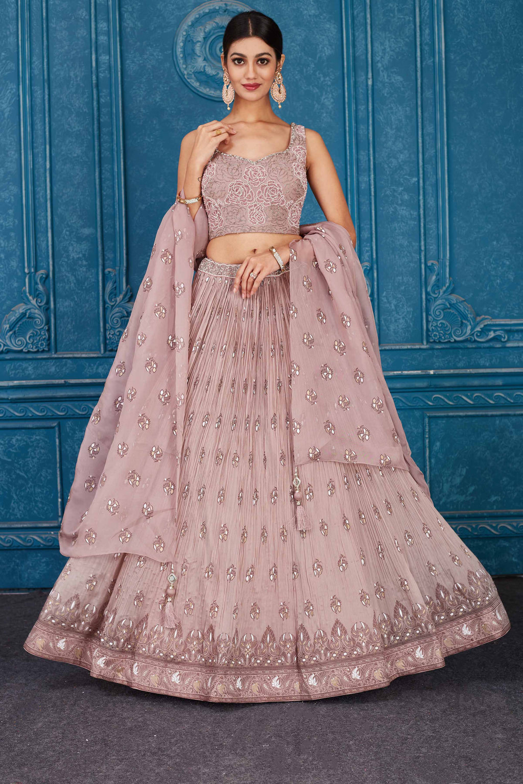 Buy dusty pink floral embroidered georgette lehenga online in USA with dupatta. Slay in style at wedding festivities in this beautiful designer lehengas. hand embroidered lehengas, Bollywood lehenga, Anarkali suits, sharara suits from Pure Elegance Indian saree store in USA. -full view