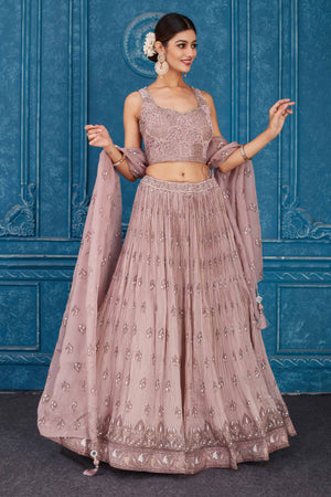 Buy dusty pink floral embroidered georgette lehenga online in USA with dupatta. Slay in style at wedding festivities in this beautiful designer lehengas. hand embroidered lehengas, Bollywood lehenga, Anarkali suits, sharara suits from Pure Elegance Indian saree store in USA. -lehenga