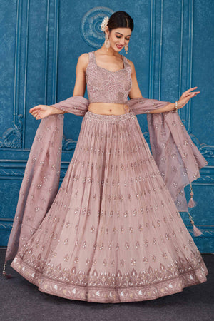 Buy dusty pink floral embroidered georgette lehenga online in USA with dupatta. Slay in style at wedding festivities in this beautiful designer lehengas. hand embroidered lehengas, Bollywood lehenga, Anarkali suits, sharara suits from Pure Elegance Indian saree store in USA. -front