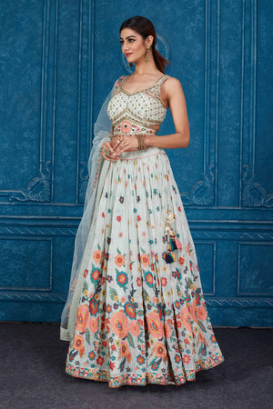 Shop stunning mint green floral embroidered georgette lehenga online in USA with dupatta. Slay in style at wedding festivities in this beautiful designer lehengas. hand embroidered lehengas, Bollywood lehenga, Anarkali suits, sharara suits from Pure Elegance Indian saree store in USA. -side