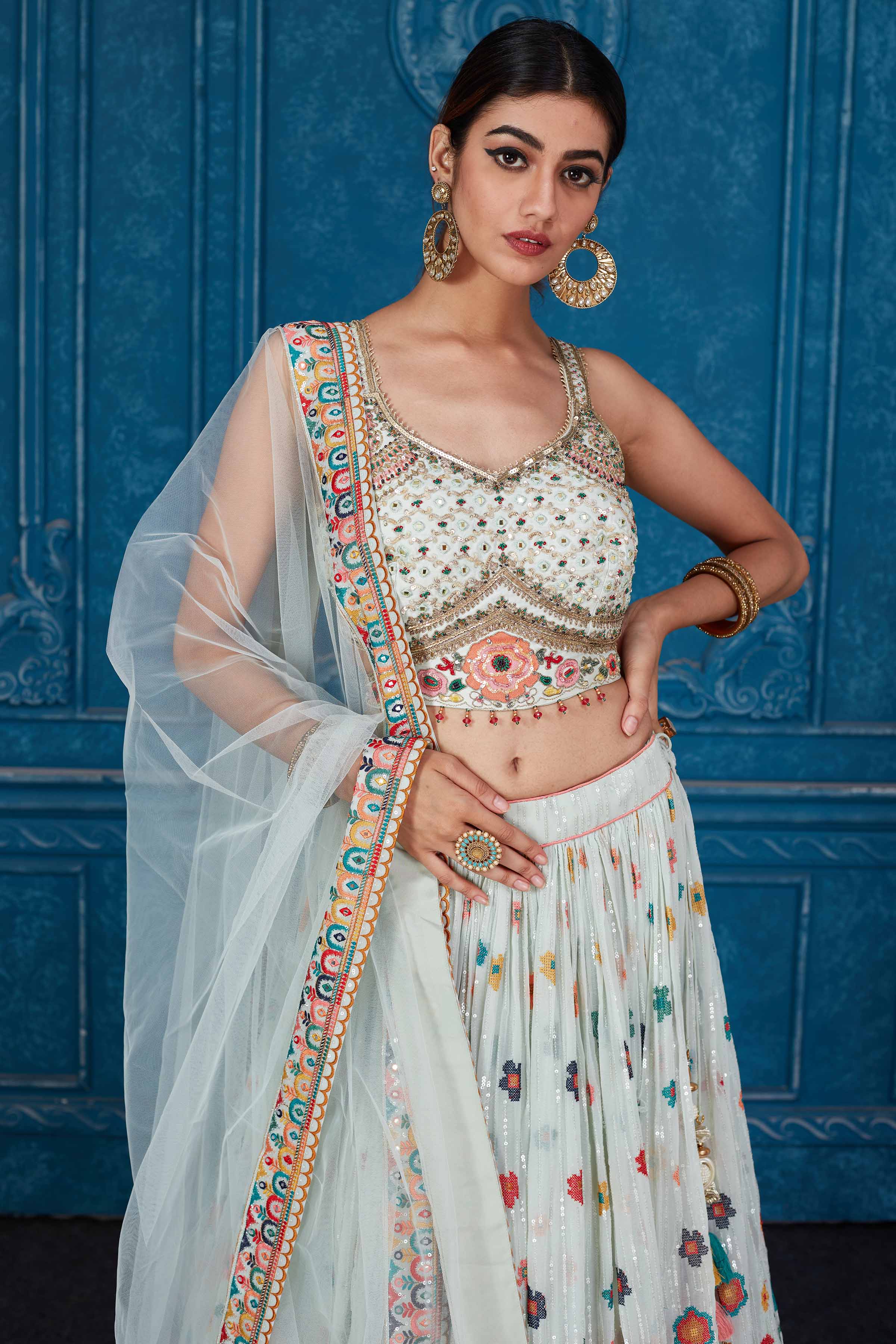 Shop stunning mint green floral embroidered georgette lehenga online in USA with dupatta. Slay in style at wedding festivities in this beautiful designer lehengas. hand embroidered lehengas, Bollywood lehenga, Anarkali suits, sharara suits from Pure Elegance Indian saree store in USA. -closeup