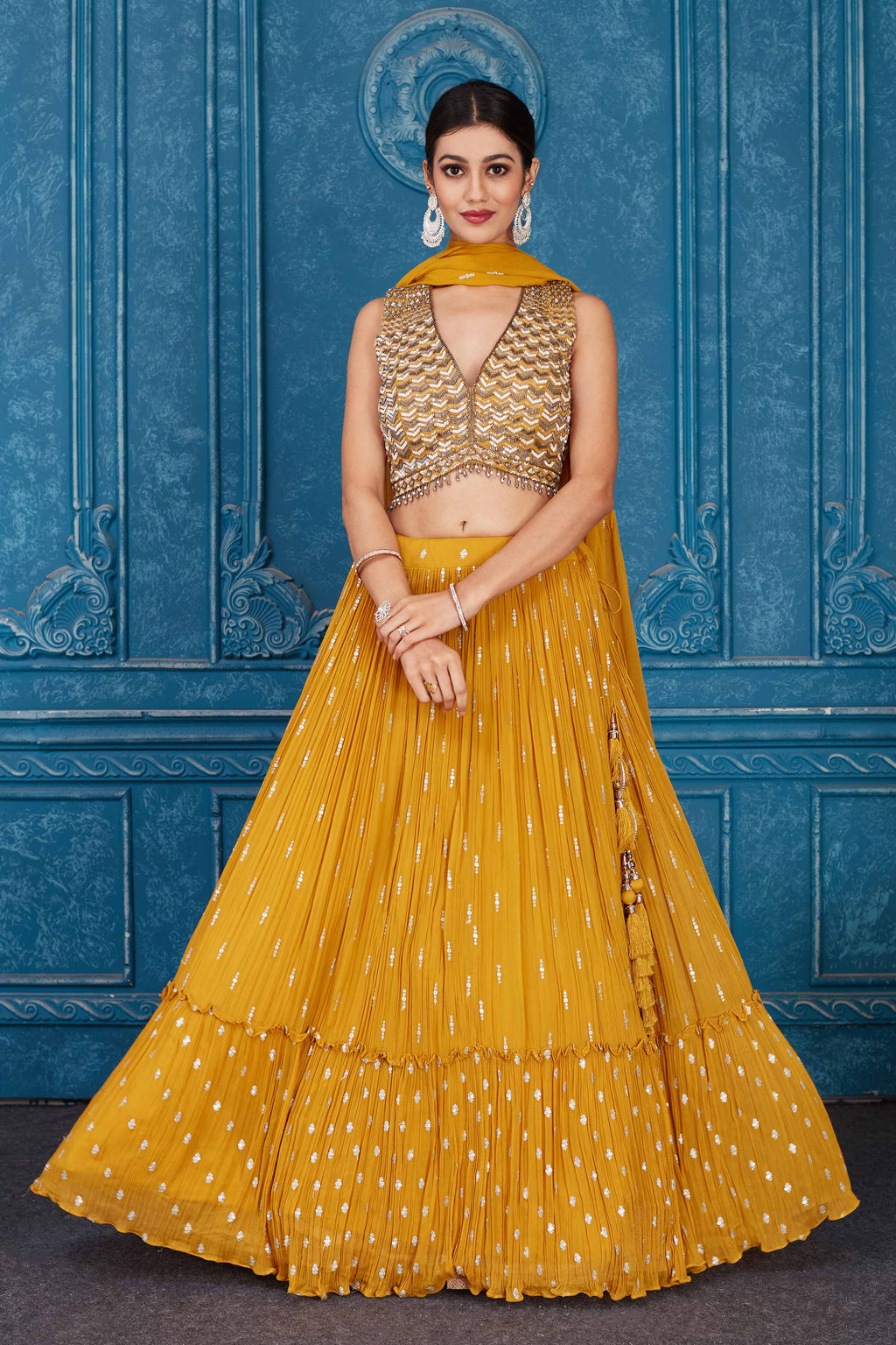 Shop beautiful mustard embroidered georgette lehenga online in USA with dupatta. Slay in style at wedding festivities in this beautiful designer lehengas. hand embroidered lehengas, Bollywood lehenga, Anarkali suits, sharara suits from Pure Elegance Indian saree store in USA. -full view