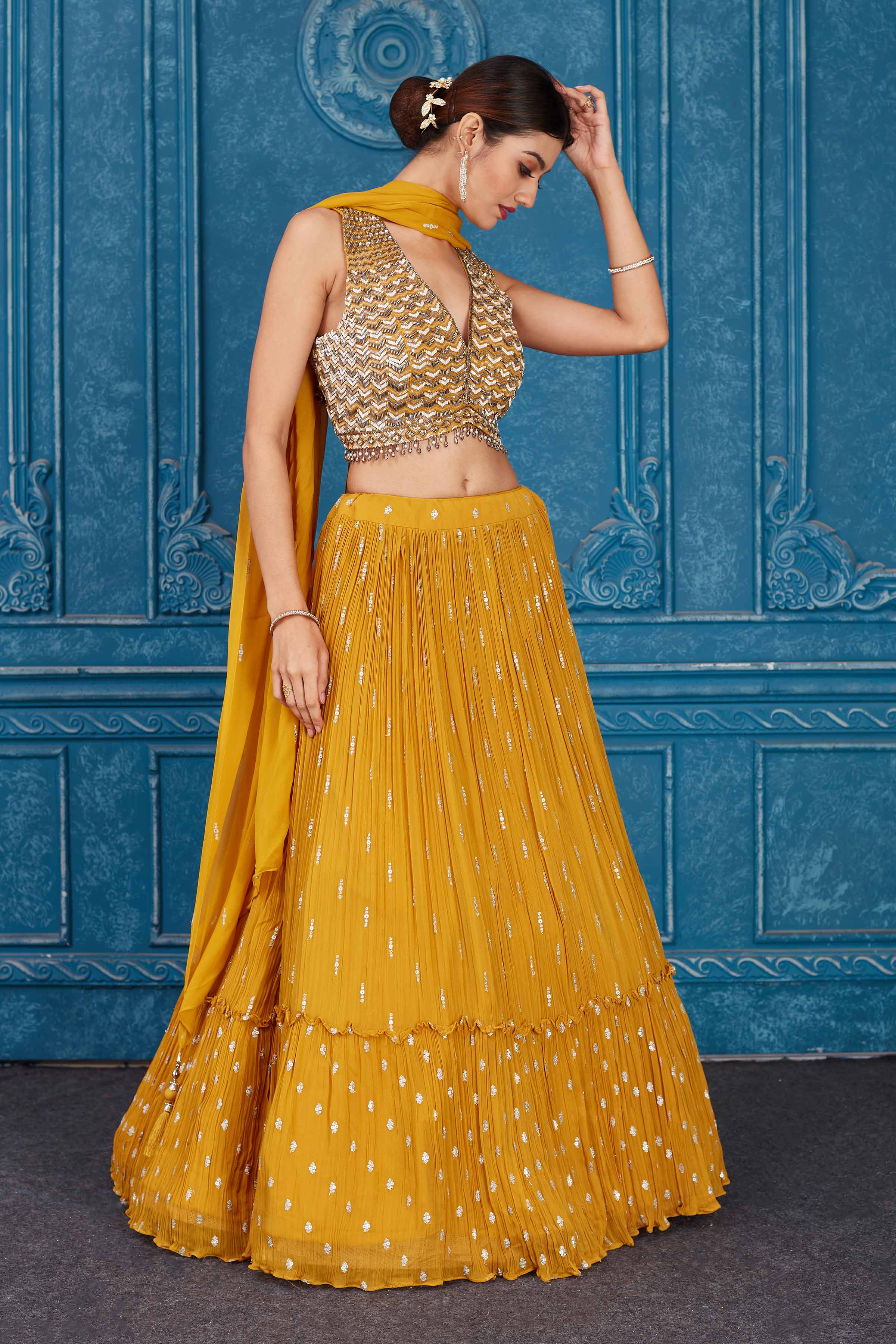 Shop beautiful mustard embroidered georgette lehenga online in USA with dupatta. Slay in style at wedding festivities in this beautiful designer lehengas. hand embroidered lehengas, Bollywood lehenga, Anarkali suits, sharara suits from Pure Elegance Indian saree store in USA. -lehenga