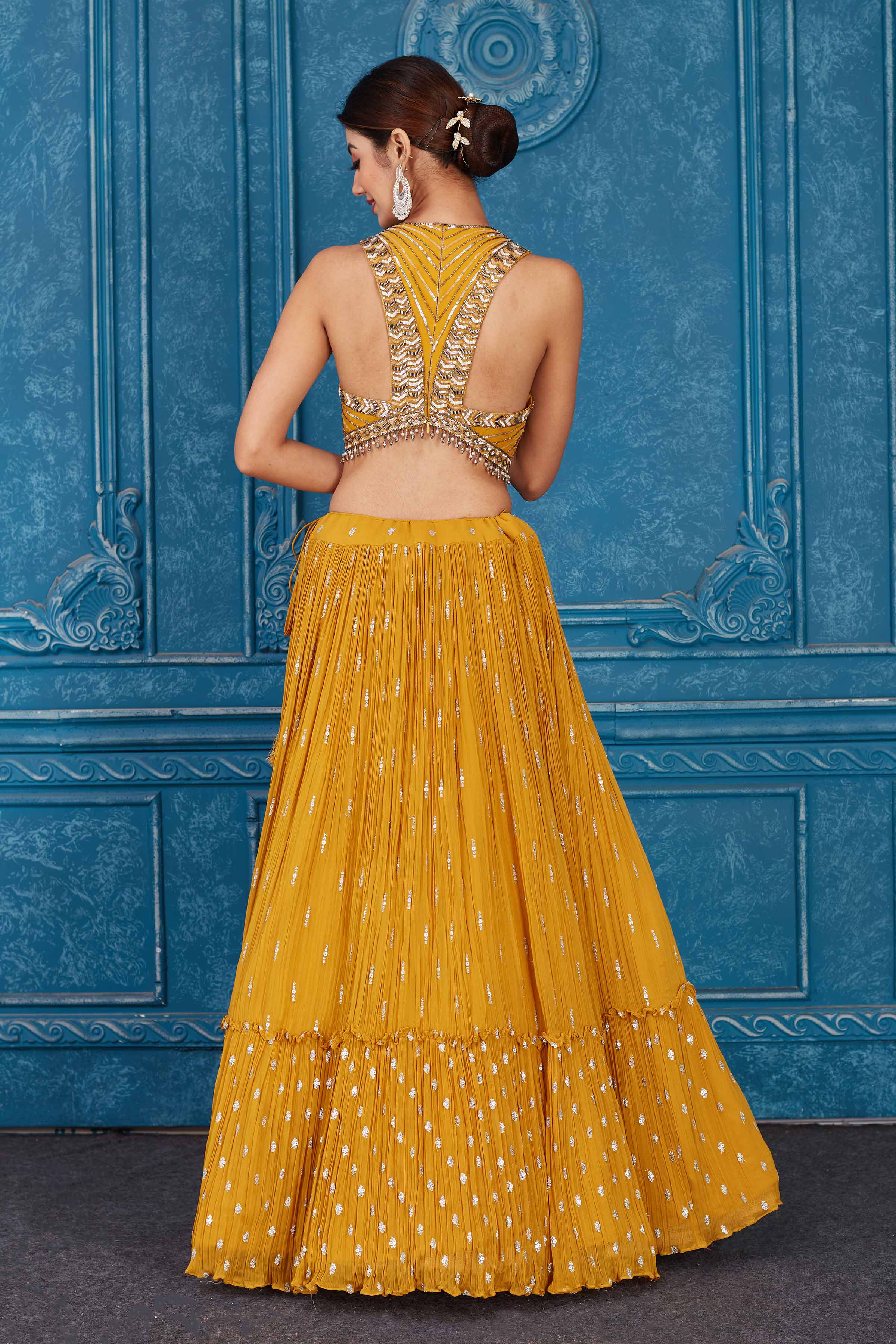 Shop beautiful mustard embroidered georgette lehenga online in USA with dupatta. Slay in style at wedding festivities in this beautiful designer lehengas. hand embroidered lehengas, Bollywood lehenga, Anarkali suits, sharara suits from Pure Elegance Indian saree store in USA. -back