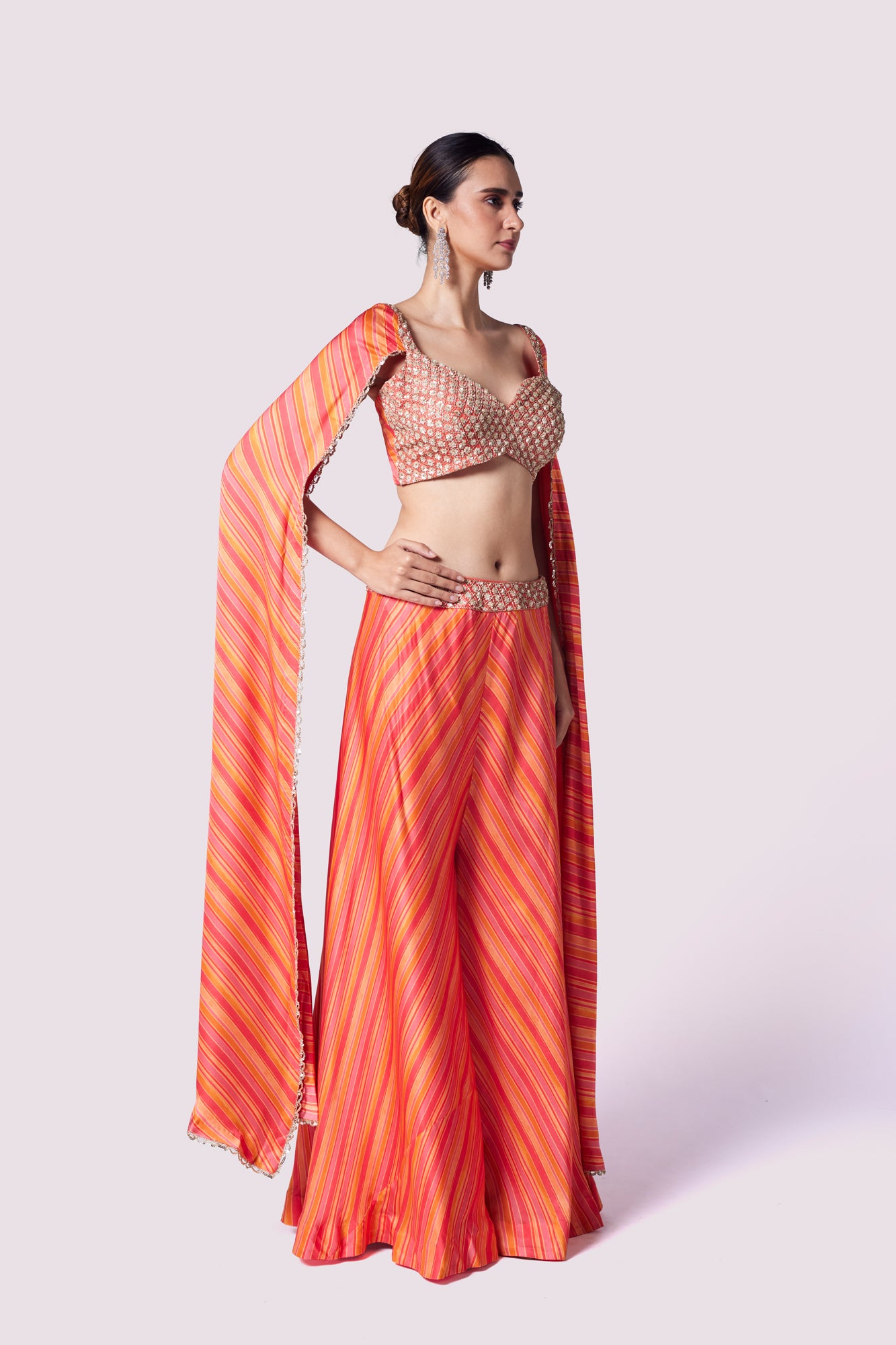 Shop stunning orange striped crepe sleeves co-ord set online in USA. Shop the best and latest designs in embroidered sarees, designer sarees, Anarkali suit, lehengas, sharara suits for weddings and special occasions from Pure Elegance Indian fashion store in USA.-side