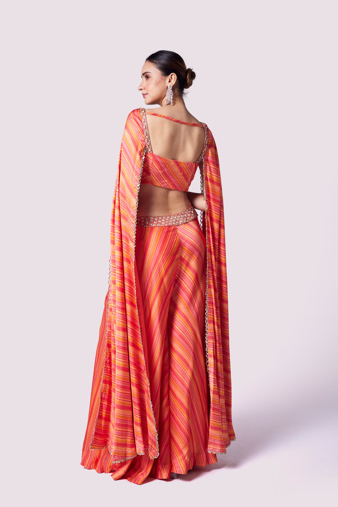 Shop stunning orange striped crepe sleeves co-ord set online in USA. Shop the best and latest designs in embroidered sarees, designer sarees, Anarkali suit, lehengas, sharara suits for weddings and special occasions from Pure Elegance Indian fashion store in USA.-back
