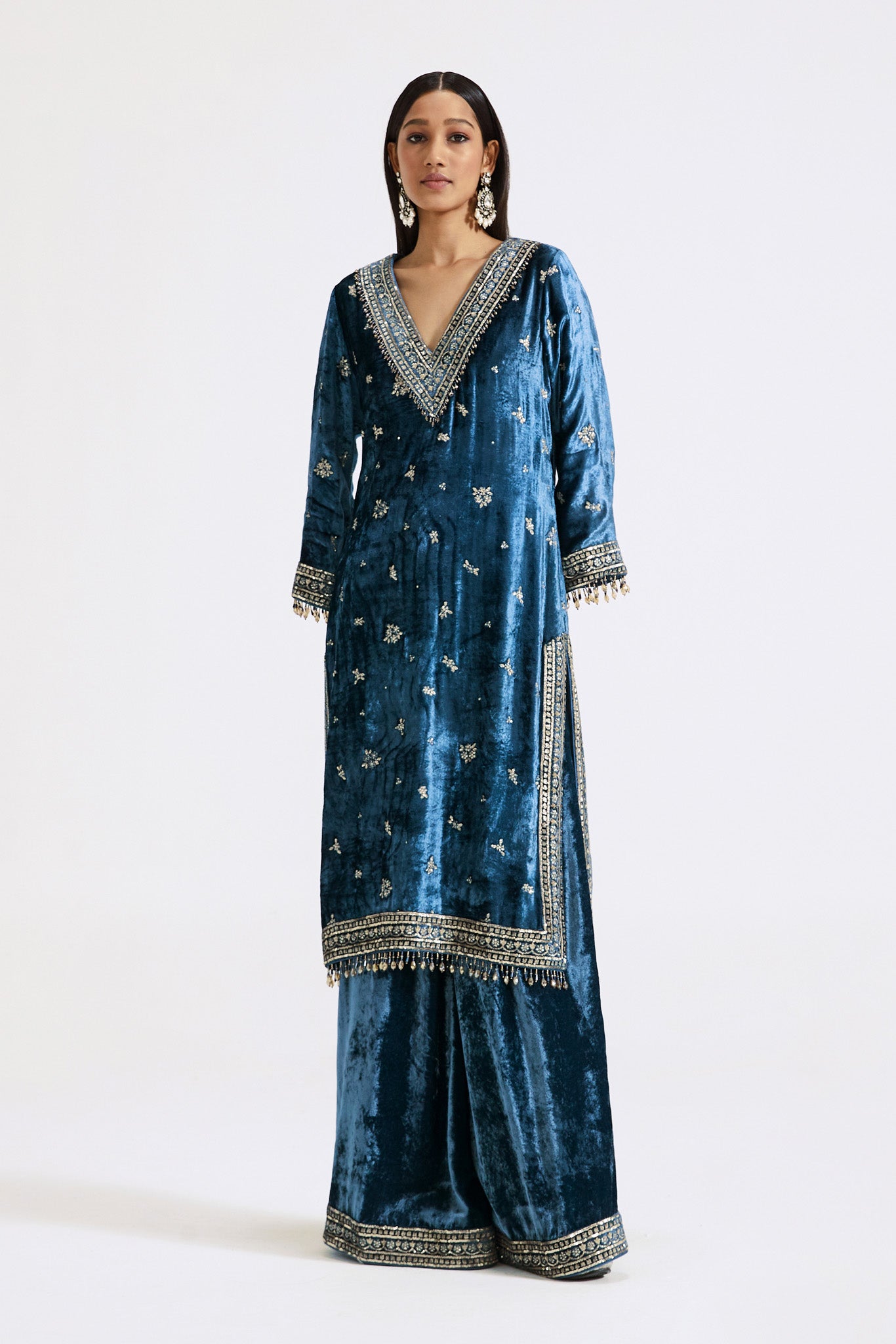 Buy blue velvet embroidered sharara suit online in USA with dupatta. Shop the best and latest designs in embroidered sarees, designer sarees, Anarkali suit, lehengas, sharara suits for weddings and special occasions from Pure Elegance Indian fashion store in USA.-front