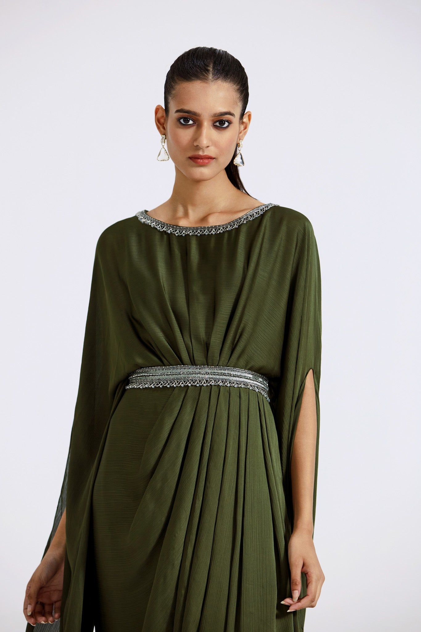 Shop beautiful moss green hand embroidered chinon gown online in USA with cape sleeves. Shop the best and latest designs in embroidered sarees, designer sarees, Anarkali suit, lehengas, sharara suits for weddings and special occasions from Pure Elegance Indian fashion store in USA.-closeup