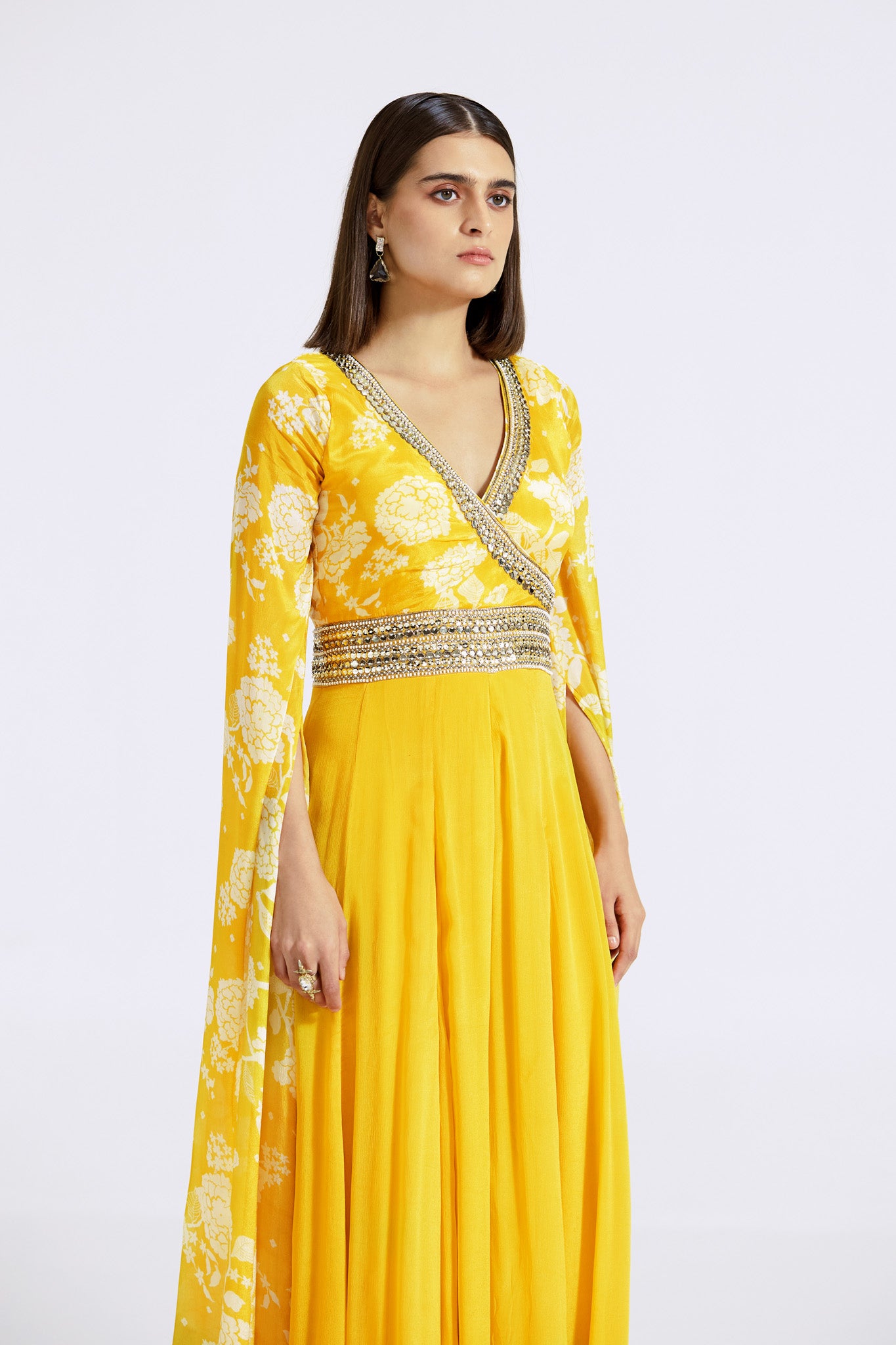 Buy yellow printed chinon jumpsuit online in USA with cape sleeves. Shop the best and latest designs in embroidered sarees, designer sarees, Anarkali suit, lehengas, sharara suits for weddings and special occasions from Pure Elegance Indian fashion store in USA.-closeup