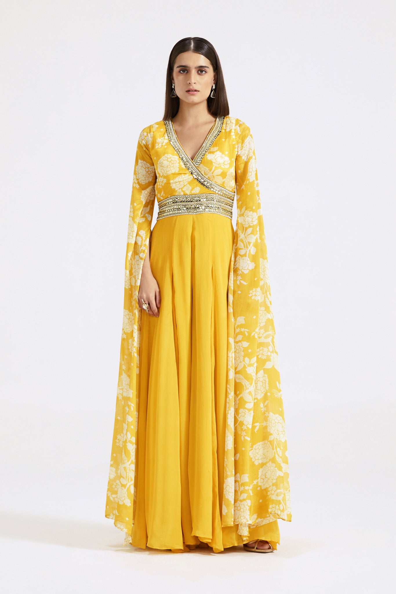 Buy yellow printed chinon jumpsuit online in USA with cape sleeves. Shop the best and latest designs in embroidered sarees, designer sarees, Anarkali suit, lehengas, sharara suits for weddings and special occasions from Pure Elegance Indian fashion store in USA.-full view