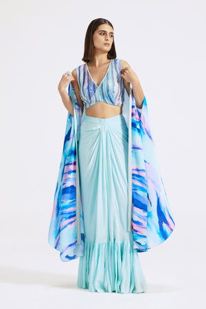 Shop stunning aqua blue crepe draped skirt set online in USA. Shop the best and latest designs in embroidered sarees, designer sarees, Anarkali suit, lehengas, sharara suits for weddings and special occasions from Pure Elegance Indian fashion store in USA.-front