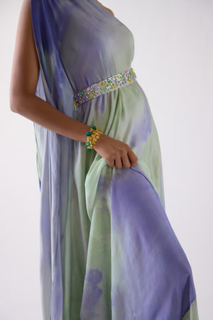 Shop lilac one shoulder crepe gown online in USA with embroidered set. Shop the best and latest designs in embroidered sarees, designer sarees, Anarkali suit, lehengas, sharara suits for weddings and special occasions from Pure Elegance Indian fashion store in USA.-side