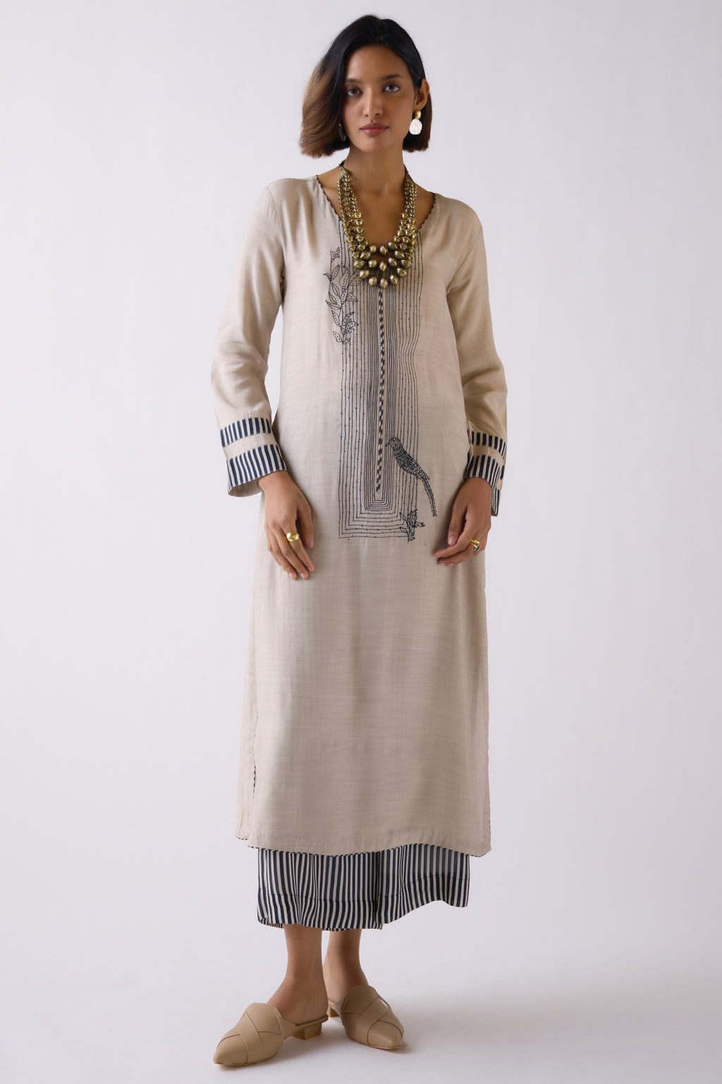 Buy stunning beige muslin kurta set online in USA with pants. Shop the best and latest designs in embroidered sarees, designer sarees, Anarkali suit, lehengas, sharara suits for weddings and special occasions from Pure Elegance Indian fashion store in USA.-full view
