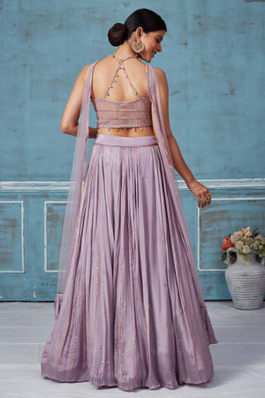 Buy lilac georgette lehenga online in USA with multicolor embroidered blouse. Look royal on special occasions in exquisite designer lehengas, pure silk sarees, handloom sarees, Bollywood sarees, Anarkali suits, Banarasi sarees, organza sarees from Pure Elegance Indian saree store in USA.-back