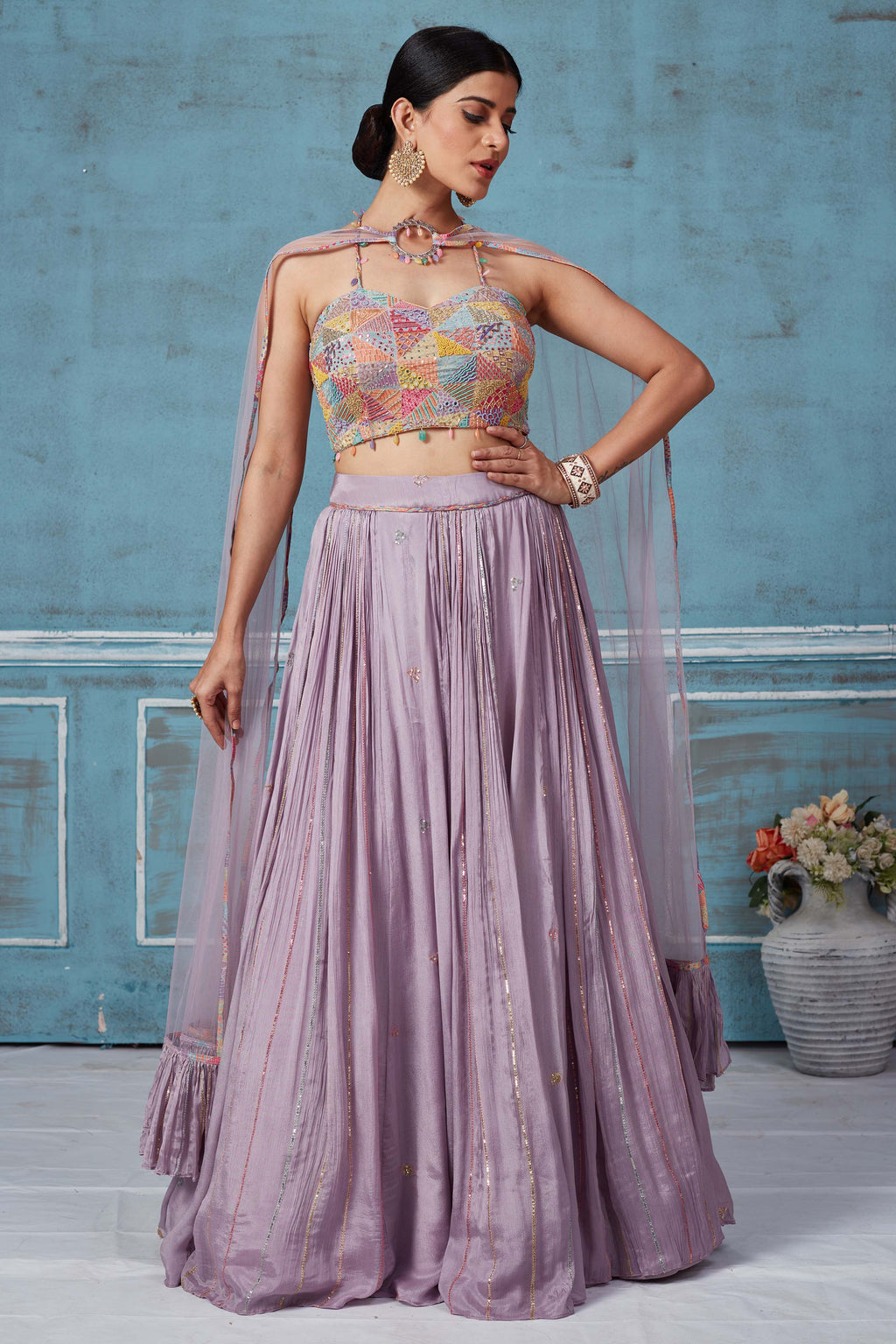 Buy lilac georgette lehenga online in USA with multicolor embroidered blouse. Look royal on special occasions in exquisite designer lehengas, pure silk sarees, handloom sarees, Bollywood sarees, Anarkali suits, Banarasi sarees, organza sarees from Pure Elegance Indian saree store in USA.-full view