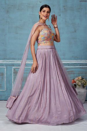 Buy lilac georgette lehenga online in USA with multicolor embroidered blouse. Look royal on special occasions in exquisite designer lehengas, pure silk sarees, handloom sarees, Bollywood sarees, Anarkali suits, Banarasi sarees, organza sarees from Pure Elegance Indian saree store in USA.-side