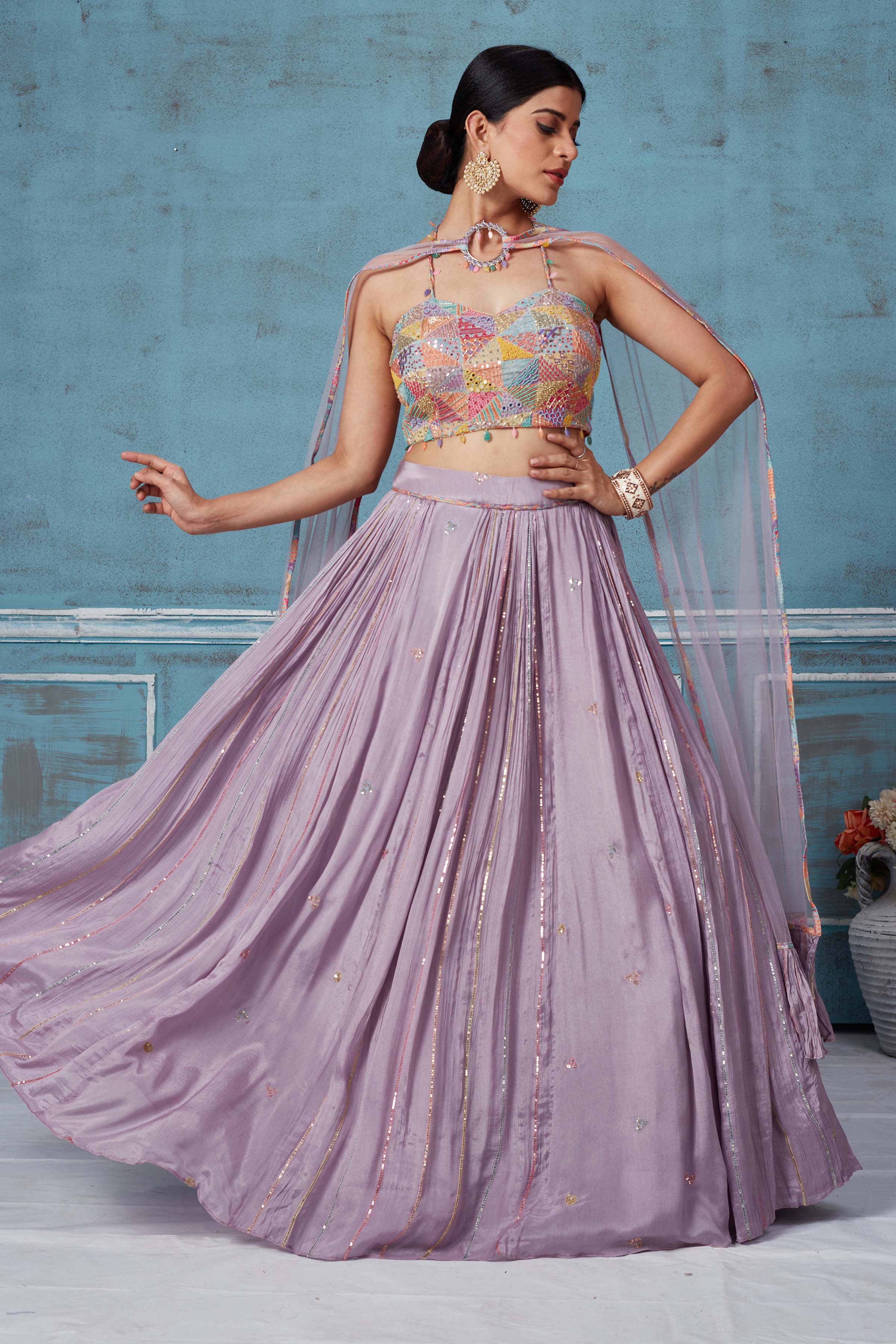 Buy lilac georgette lehenga online in USA with multicolor embroidered blouse. Look royal on special occasions in exquisite designer lehengas, pure silk sarees, handloom sarees, Bollywood sarees, Anarkali suits, Banarasi sarees, organza sarees from Pure Elegance Indian saree store in USA.-front