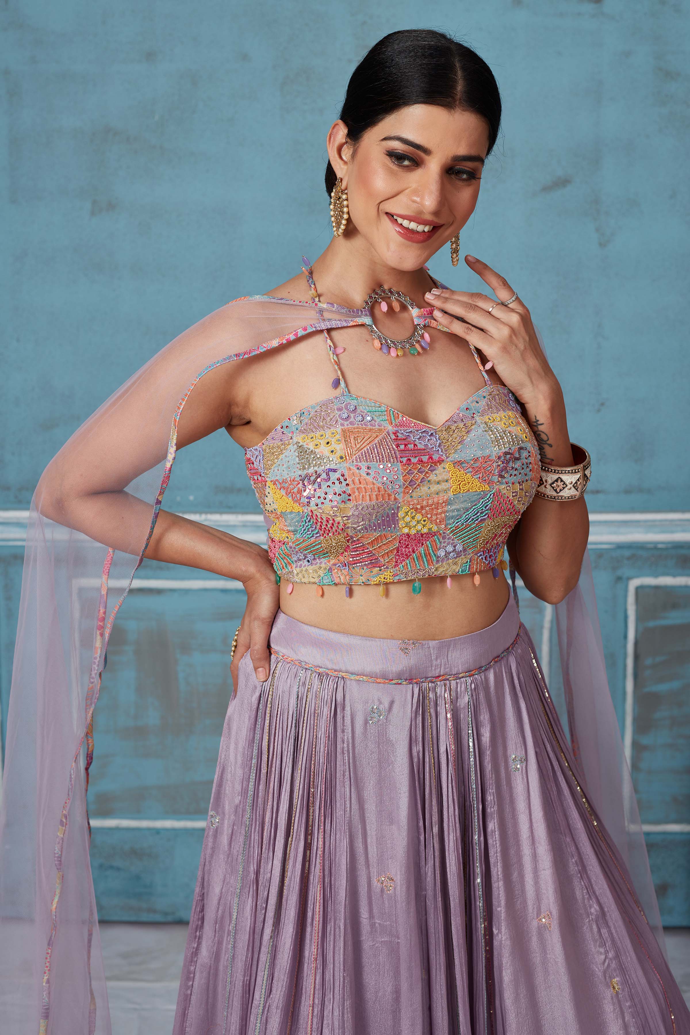 Buy lilac georgette lehenga online in USA with multicolor embroidered blouse. Look royal on special occasions in exquisite designer lehengas, pure silk sarees, handloom sarees, Bollywood sarees, Anarkali suits, Banarasi sarees, organza sarees from Pure Elegance Indian saree store in USA.-closeup