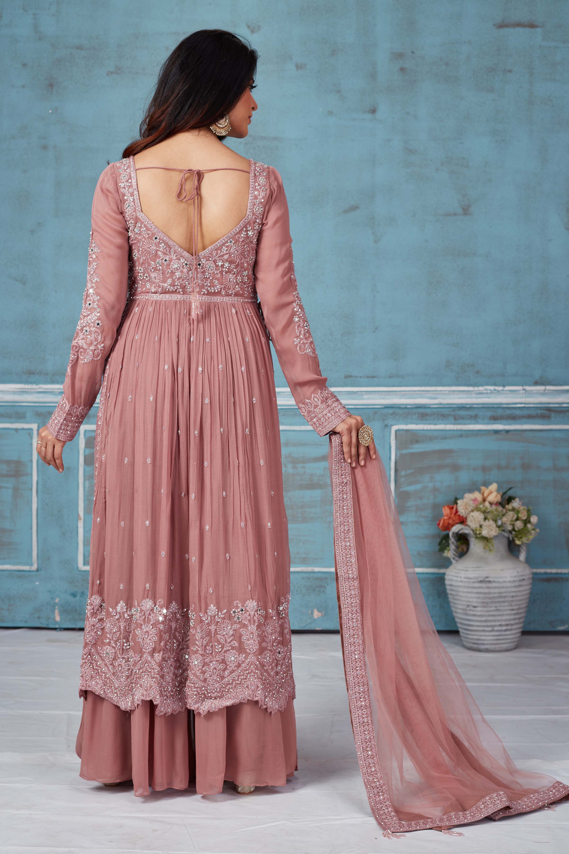 Buy dusty pink embroidered georgette palazzo suit online in USA with dupatta. Look royal on special occasions in exquisite designer lehengas, pure silk sarees, handloom sarees, Bollywood sarees, Anarkali suits, Banarasi sarees, organza sarees from Pure Elegance Indian saree store in USA.-back