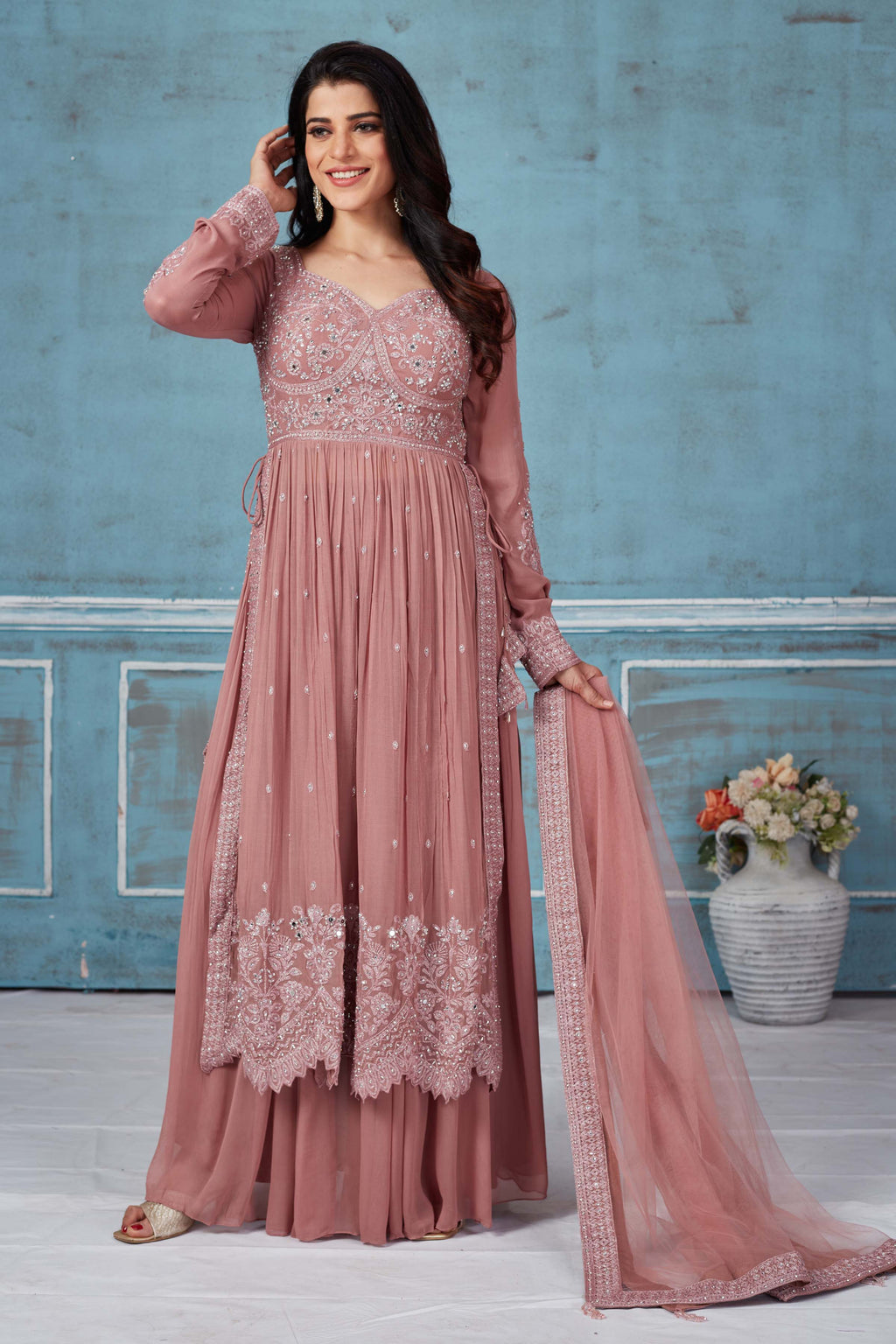 Buy dusty pink embroidered georgette palazzo suit online in USA with dupatta. Look royal on special occasions in exquisite designer lehengas, pure silk sarees, handloom sarees, Bollywood sarees, Anarkali suits, Banarasi sarees, organza sarees from Pure Elegance Indian saree store in USA.-full view