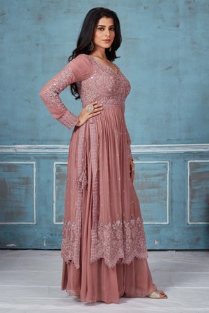 Buy dusty pink embroidered georgette palazzo suit online in USA with dupatta. Look royal on special occasions in exquisite designer lehengas, pure silk sarees, handloom sarees, Bollywood sarees, Anarkali suits, Banarasi sarees, organza sarees from Pure Elegance Indian saree store in USA.-side
