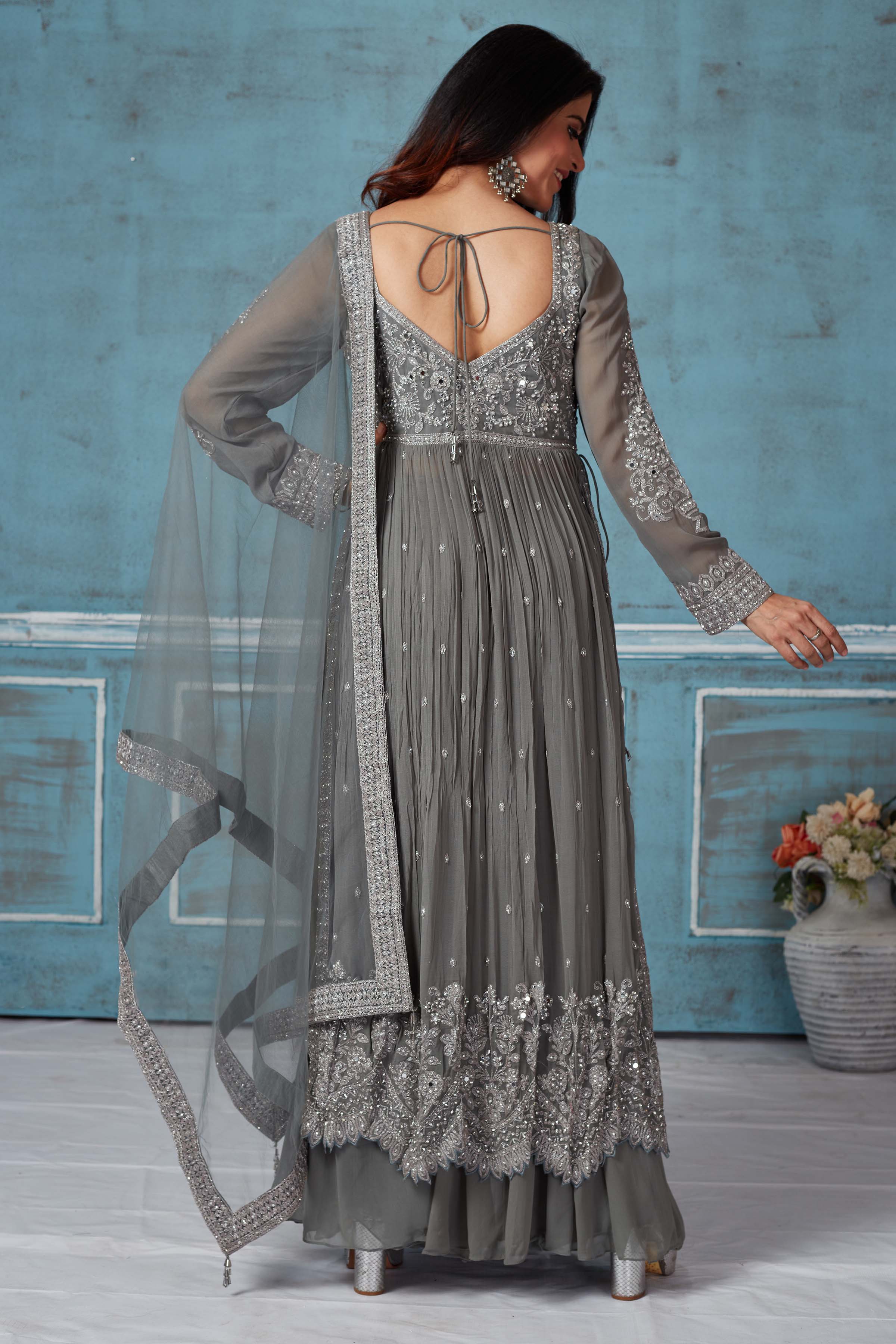  Buy grey embroidered georgette palazzo suit online in USA with dupatta. Look royal on special occasions in exquisite designer lehengas, pure silk sarees, handloom sarees, Bollywood sarees, Anarkali suits, Banarasi sarees, organza sarees from Pure Elegance Indian saree store in USA.-back\