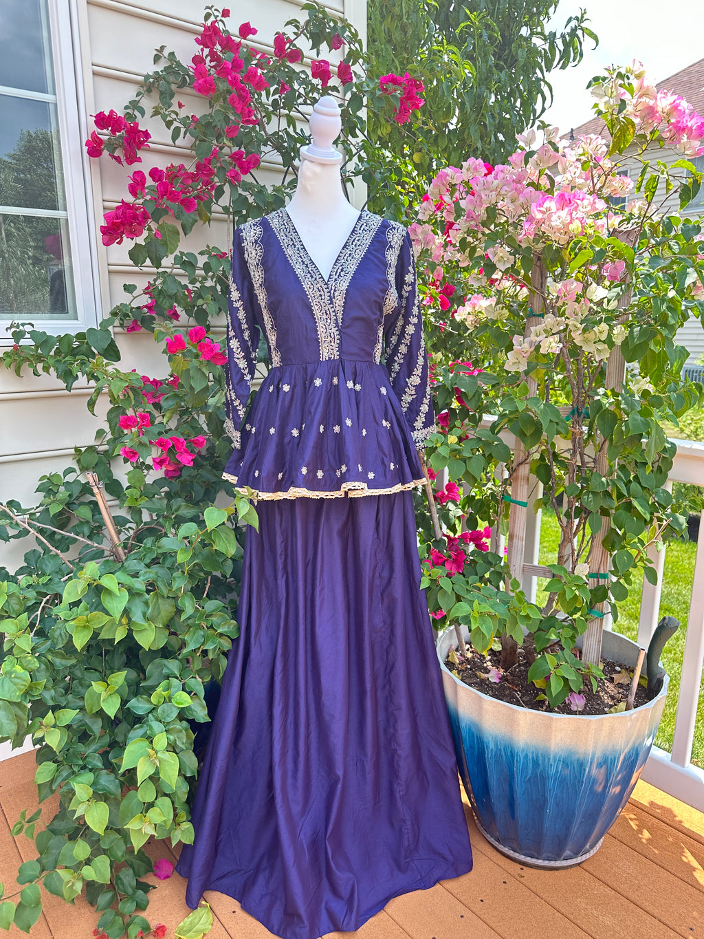 Shop purple embroidered peplum top skirt set online in USA. Look your best on festive occasions in latest designer suits, Banarasi sarees, handwoven sarees.-full view