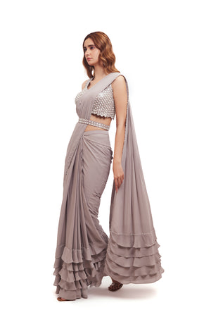 Buy grey georgette ruffle drape saree online in USA with embellished blouse. Look your best at parties and weddings in beautiful designer sarees, embroidered sarees, handwoven sarees, silk sarees, organza saris from Pure Elegance Indian saree store in USA.-side