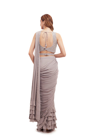 Buy grey georgette ruffle drape saree online in USA with embellished blouse. Look your best at parties and weddings in beautiful designer sarees, embroidered sarees, handwoven sarees, silk sarees, organza saris from Pure Elegance Indian saree store in USA.-back