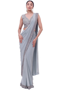 Shop powder blue embroidered drape saree online in USA with blouse. Look your best at parties and weddings in beautiful designer sarees, embroidered sarees, handwoven sarees, silk sarees, organza saris from Pure Elegance Indian saree store in USA.-full view