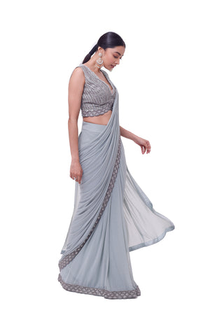 Shop powder blue embroidered drape saree online in USA with blouse. Look your best at parties and weddings in beautiful designer sarees, embroidered sarees, handwoven sarees, silk sarees, organza saris from Pure Elegance Indian saree store in USA.-side
