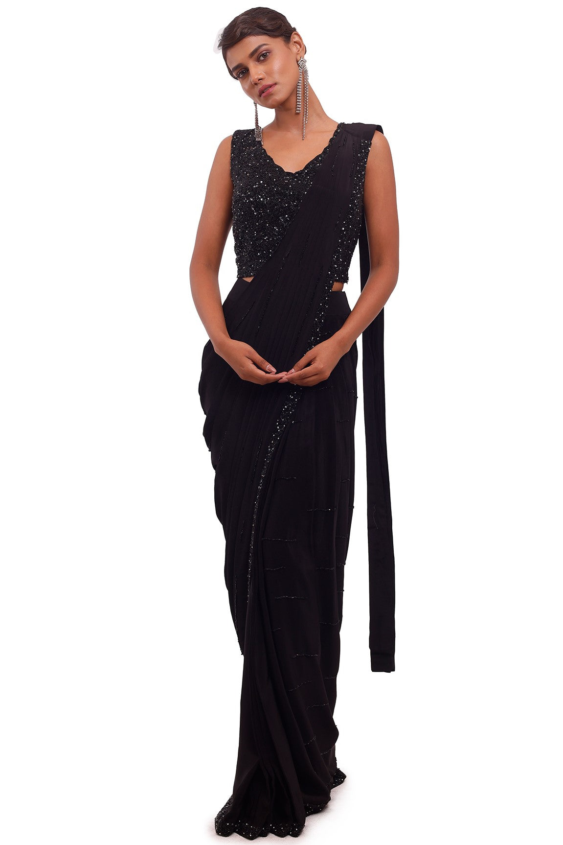 Buy beautiful black crepe draped saree online in USA with sequin blouse. Look your best at parties and weddings in beautiful designer sarees, embroidered sarees, handwoven sarees, silk sarees, organza saris from Pure Elegance Indian saree store in USA.-full view