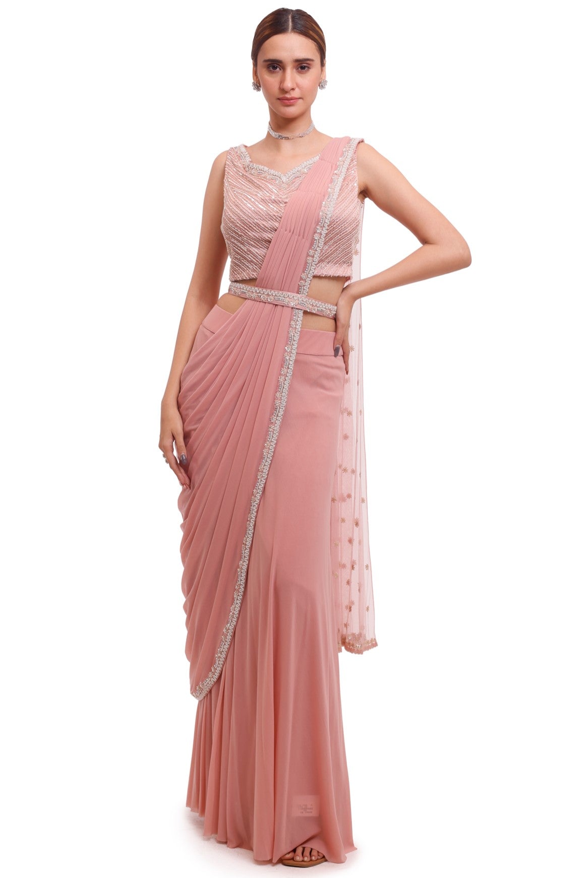 Buy stunning light pink draped lycra saree online in USA with embellished blouse. Look your best at parties and weddings in beautiful designer sarees, embroidered sarees, handwoven sarees, silk sarees, organza saris from Pure Elegance Indian saree store in USA.-full view