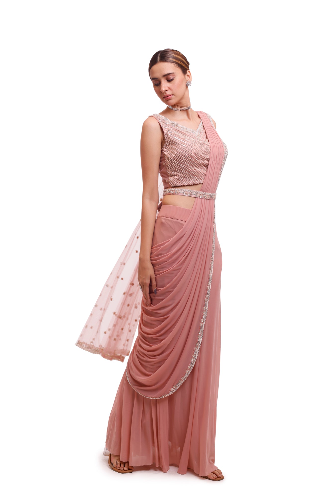 Buy stunning light pink draped lycra saree online in USA with embellished blouse. Look your best at parties and weddings in beautiful designer sarees, embroidered sarees, handwoven sarees, silk sarees, organza saris from Pure Elegance Indian saree store in USA.-side