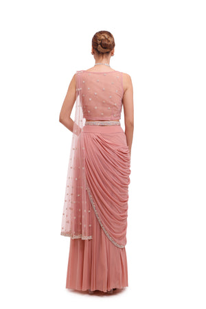 Buy stunning light pink draped lycra saree online in USA with embellished blouse. Look your best at parties and weddings in beautiful designer sarees, embroidered sarees, handwoven sarees, silk sarees, organza saris from Pure Elegance Indian saree store in USA.-back