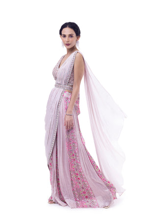 Shop light pink pre-draped chiffon saree online in USA with embellished blouse. Look your best at parties and weddings in beautiful designer sarees, embroidered sarees, handwoven sarees, silk sarees, organza saris from Pure Elegance Indian saree store in USA.-side