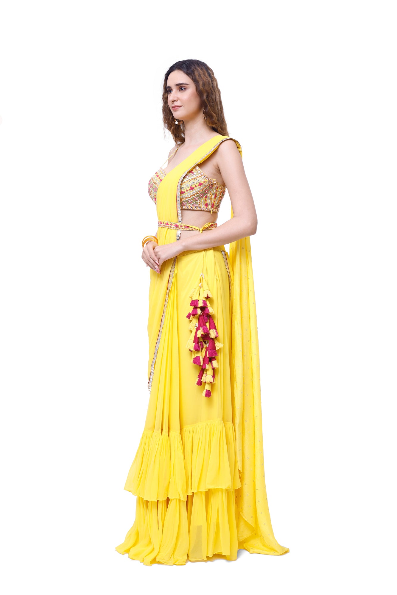 Shop beautiful yellow georgette ruffle sharara drape saree online in USA with blouse. Look your best at parties and weddings in beautiful designer sarees, embroidered sarees, handwoven sarees, silk sarees, organza saris from Pure Elegance Indian saree store in USA.-side