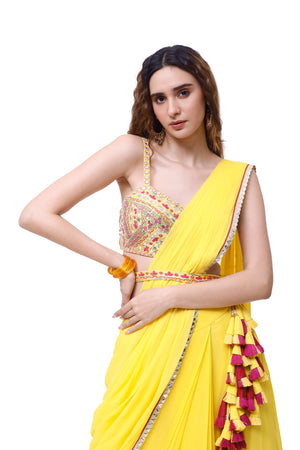 Shop beautiful yellow georgette ruffle sharara drape saree online in USA with blouse. Look your best at parties and weddings in beautiful designer sarees, embroidered sarees, handwoven sarees, silk sarees, organza saris from Pure Elegance Indian saree store in USA.-closeup