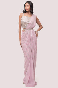 Shop stunning powder pink embroidered drape saree online in USA with blouse. Look your best at parties and weddings in beautiful designer sarees, embroidered sarees, handwoven sarees, silk sarees, organza saris from Pure Elegance Indian saree store in USA.-full view